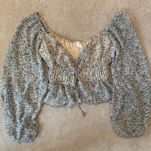 Long sleeve floral top. From a small boutique. V-neck cut and slightly cropped